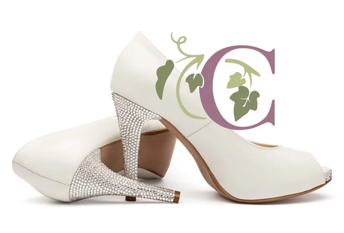 A pair of white wedding shoes embellished with rhinestones, perfect for a country bridal theme.