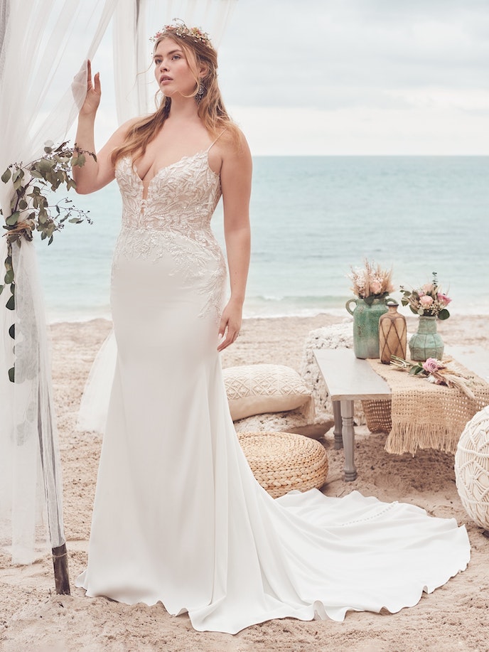 A plus size bride in an Alda Wedding Dress on the beach.