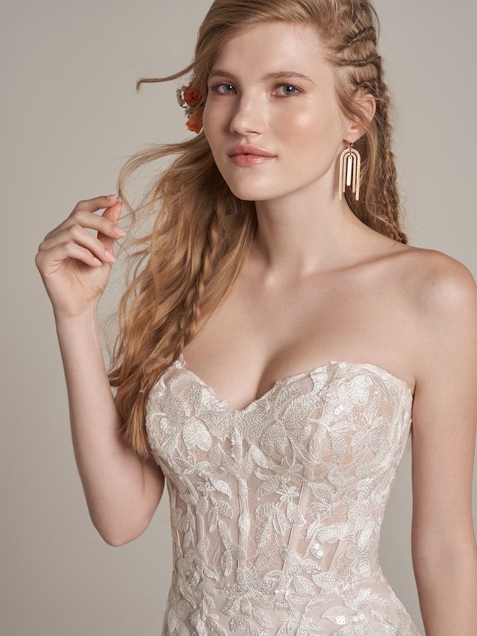 A beautiful bride in a strapless Lily wedding dress.